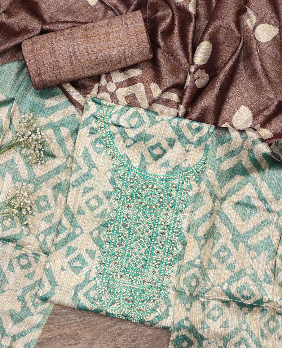 Green material chudidar set, batik style printed with neck embroidered top, contrast plain bottom, and batik printed dupatta