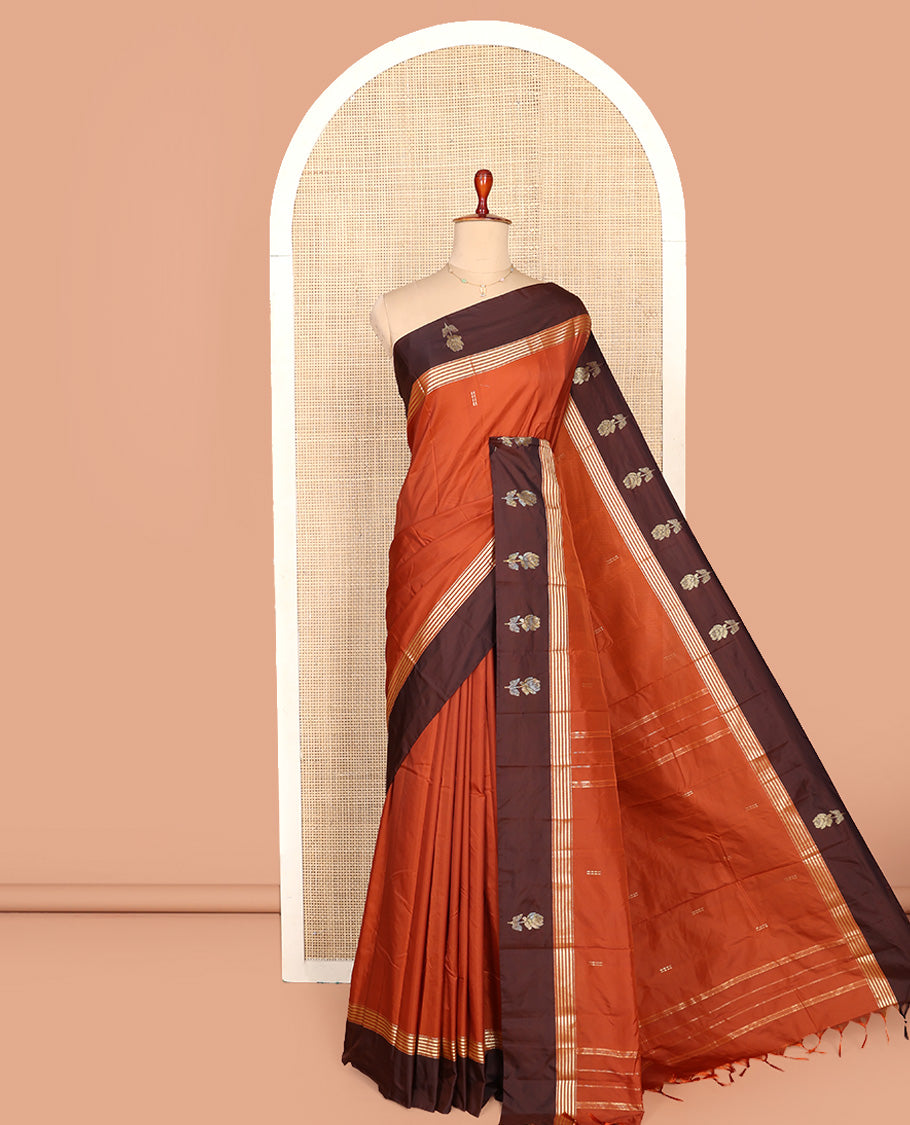 Rust Aarani Silk Saree, Adorned with Zari Buttas All Over Its Body, Complemented by a Contrast Zari Border of Floral Motifs, Pallu of Stripes and Buttas, and Paired with a Matching Blouse
