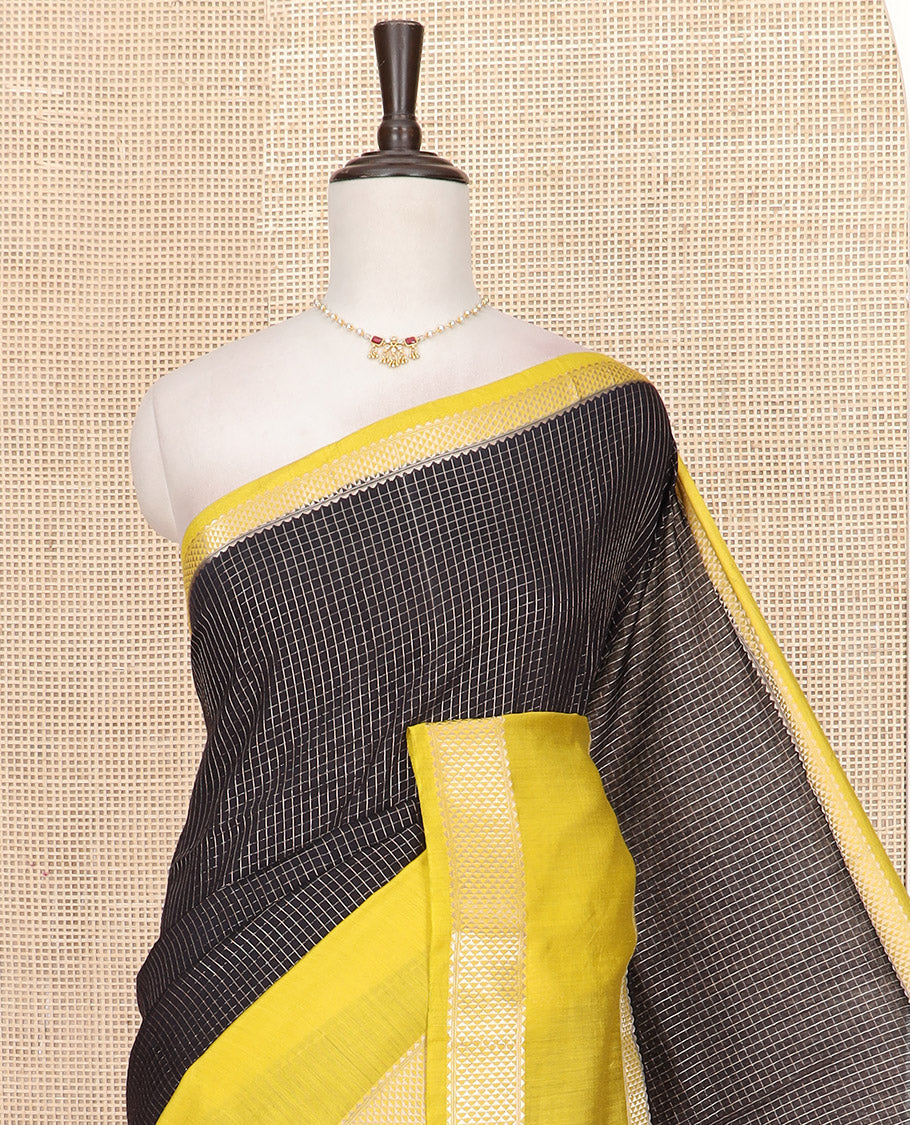 Black Assam Silk Saree Elegantly Sparkled with Zari Checks, Complemented by Contrast Zari Border of Triangle Motifs, a Gleaming Pallu of Zari Stripes, and Paired with a Contrast Blouse