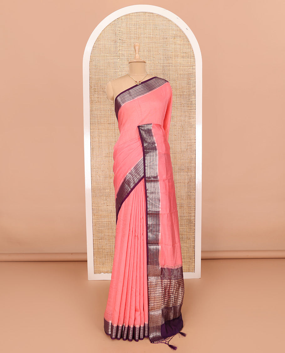 Peach Assam Silk Saree Features Sparsely Woven Buttas, Complemented by Contrast Traditional Zari Design Border, Pallu Elevated with Zari Stripes, and Paired with a Contrast Blouse