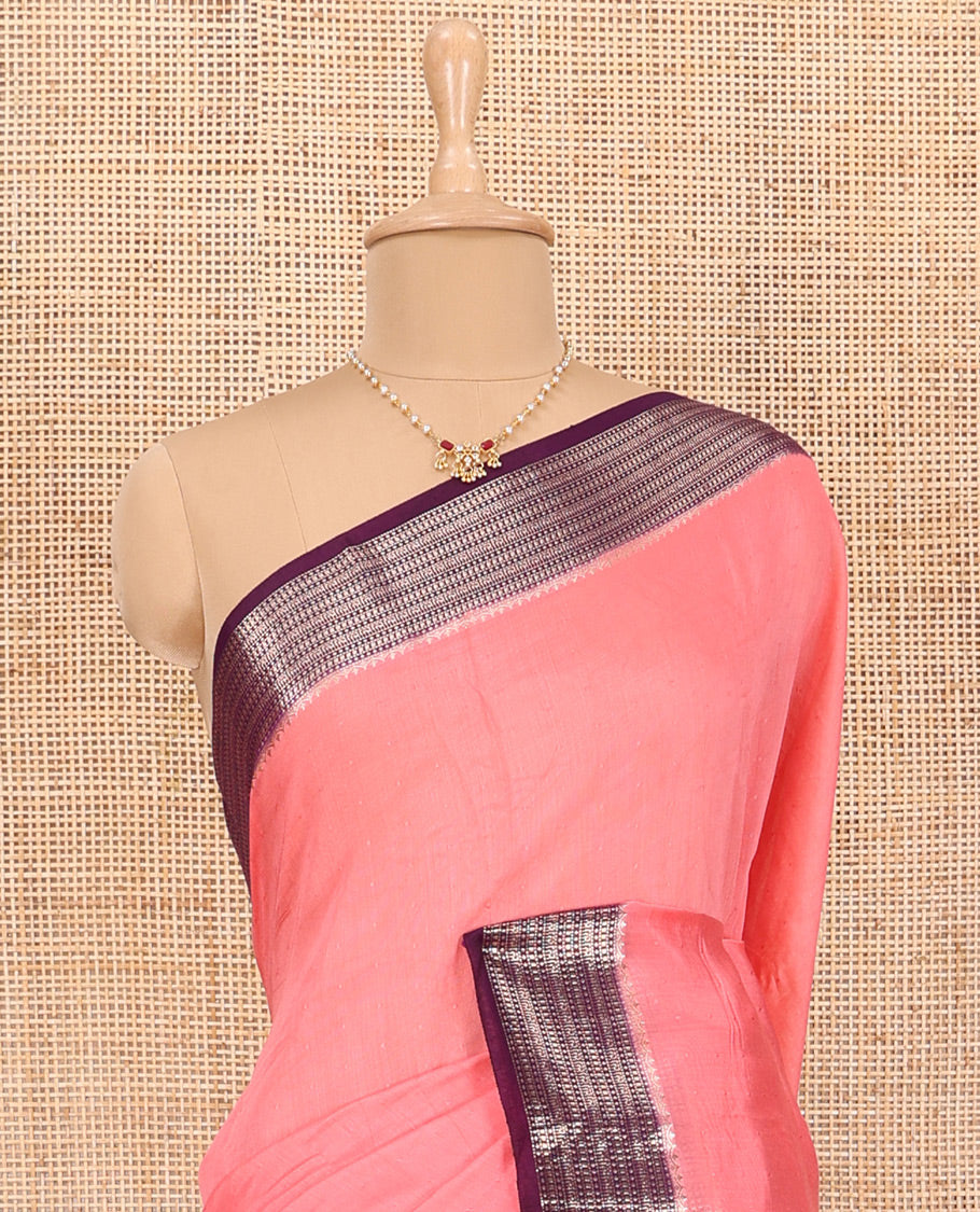 Peach Assam Silk Saree Features Sparsely Woven Buttas, Complemented by Contrast Traditional Zari Design Border, Pallu Elevated with Zari Stripes, and Paired with a Contrast Blouse