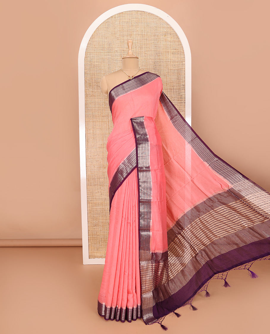 Peach Assam Silk Saree Features Sparsely Woven Buttas, Complemented by Contrast Traditional Zari Design Border, Pallu Elevated with Zari Stripes, and Paired with a Contrast Blouse