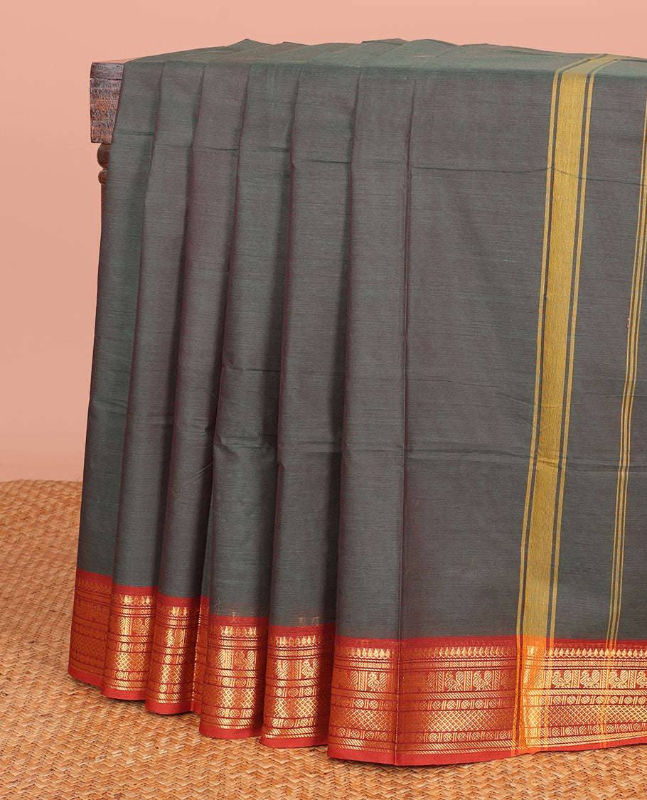 Green Plain Chettinad Cotton Saree, Complemented by a Contrast Traditional Motifs Woven Zari Temple Border, and Subtly Striped Pallu