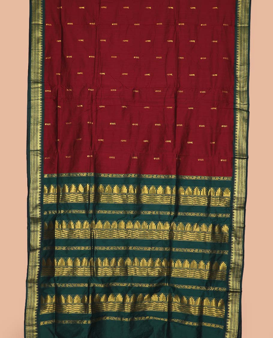 Maroon buttas nine-yard cotton saree, contrast traditional zari border, and pallu steeped with traditional motifs
