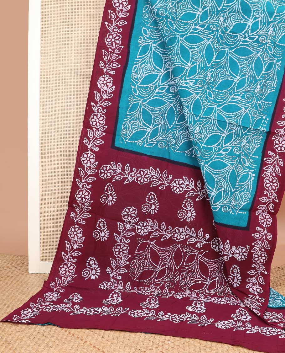 Blue batik printed sungudi cotton saree, contrast floral batik border, and batik floral pallu