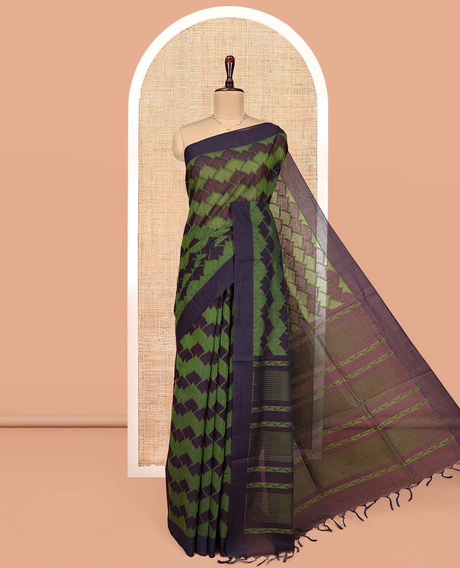 Green Coimbatore Cotton Saree, Ornamented with Scallop Design on Its Body, a Contrast Plain Border, Pallu of Floral Creeper, and Stripes, and Paired with Contrast Blouse