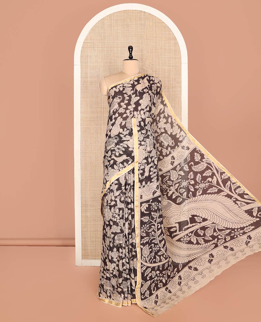 Black Machine-Printed Kalamkari Cotton Saree Features Flora-Fauna Motifs, a Piping Border, Pallu of Peacock Motifs, and a Matching Blouse