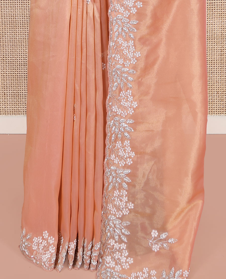 Peach Designer Saree, Beautifully Bedecked with Stone-Embroidered Buttas on Its Body, Highlighted by a Scallop Floral-Themed Embroidered Border, Self-Pallu, and Paired with a Matching Blouse