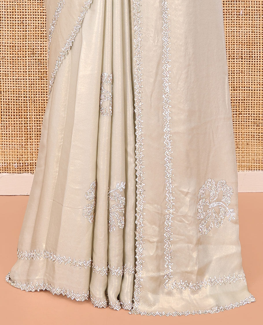 Champagne Designer Saree, Spotlighted by Zari Buttas All Over Its Body, Scallop Stone Work Border, and Paired with a Matching Blouse