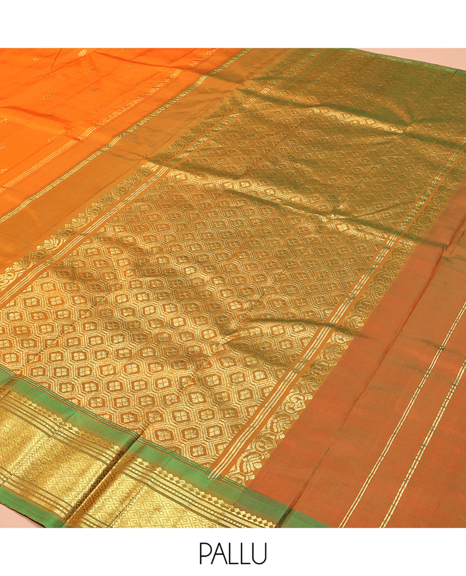 Orange Kanchipuram Silk Saree, Crafted with Zari Buttas, Complemented by a Contrast One-Sided Border of Panner Sombu, Banaras, Muthu and Mayil Kann Designs, Grand Jaal Pallu, and No Blouse