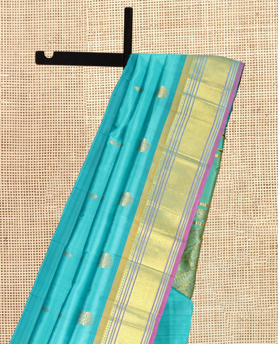Blue Kanchipuram Silk Saree, Woven with Zari Buttas, a Contrast One-Sided Border of Panner Sombu, Banaras, Muthu, and Jaal Designs, Kodi Visiry Pallu, and a No Blouse