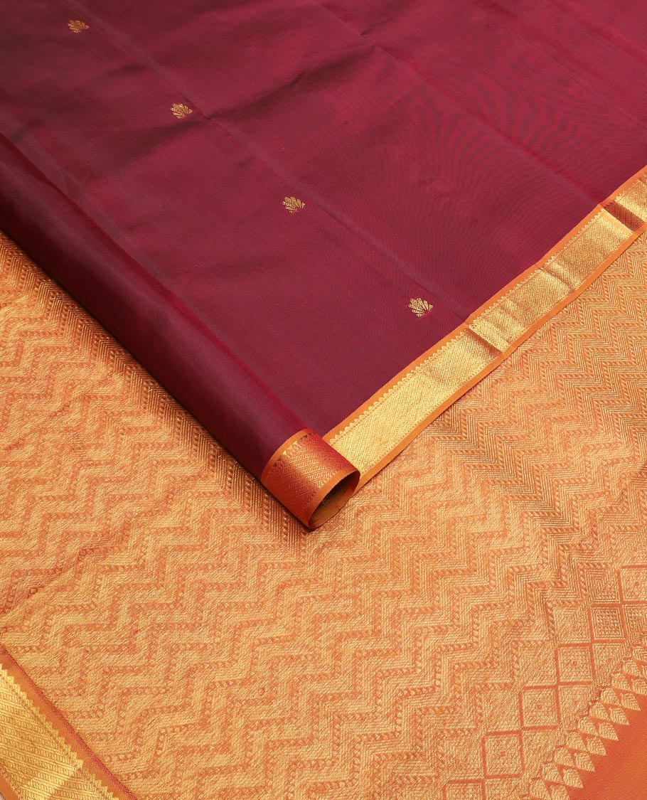 Maroon zari buttas Kanchipuram silk saree, contrast border of rekku, and muthu designs, and chevron design pallu