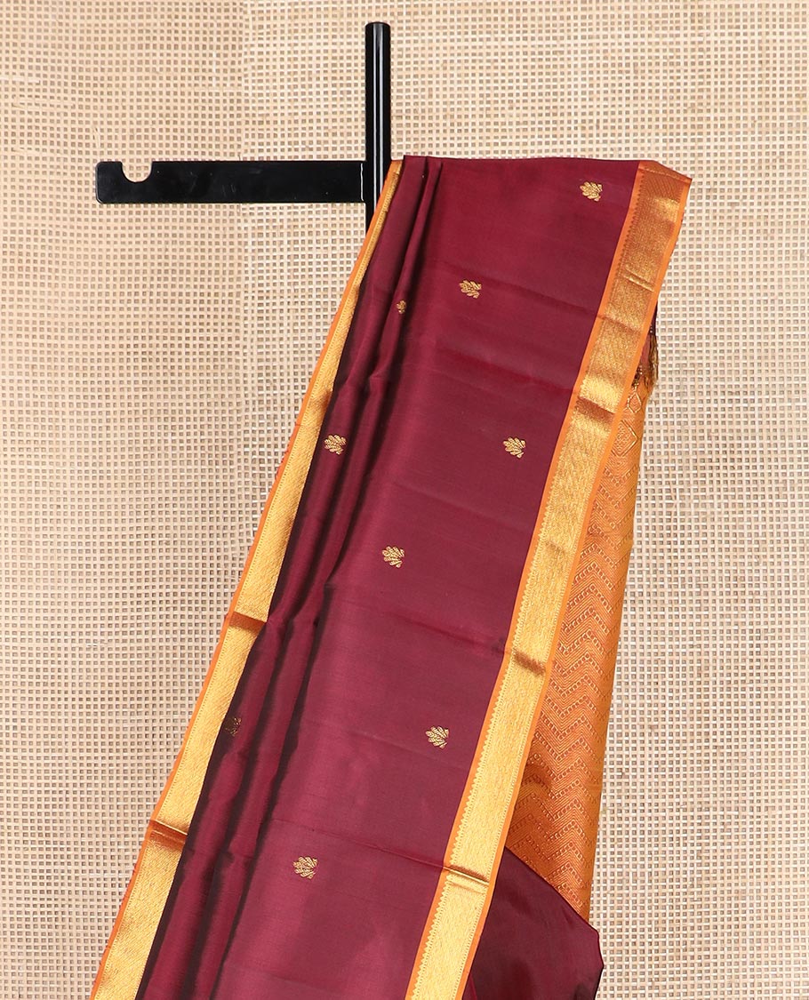 Maroon zari buttas Kanchipuram silk saree, contrast border of rekku, and muthu designs, and chevron design pallu