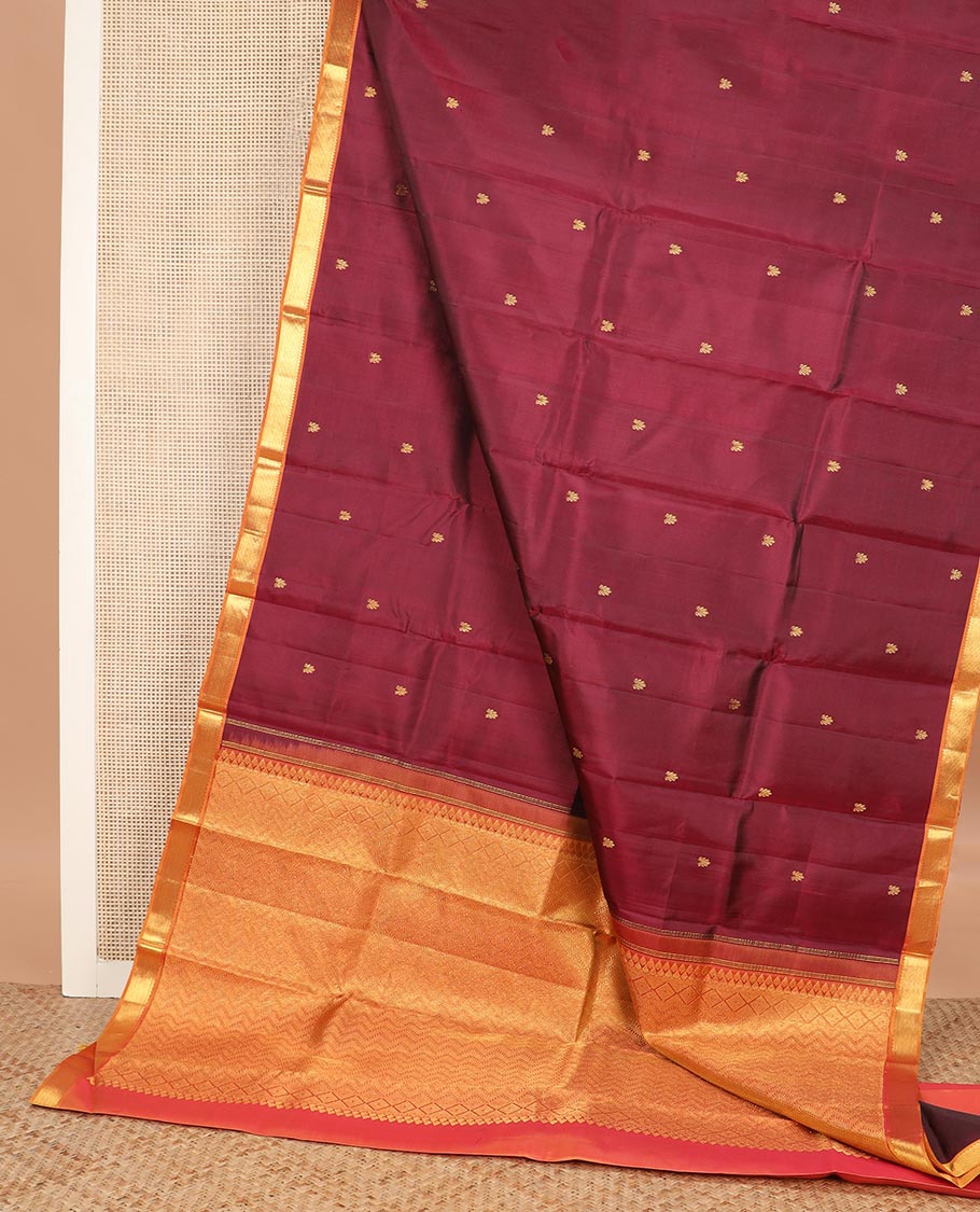 Maroon zari buttas Kanchipuram silk saree, contrast border of rekku, and muthu designs, and chevron design pallu