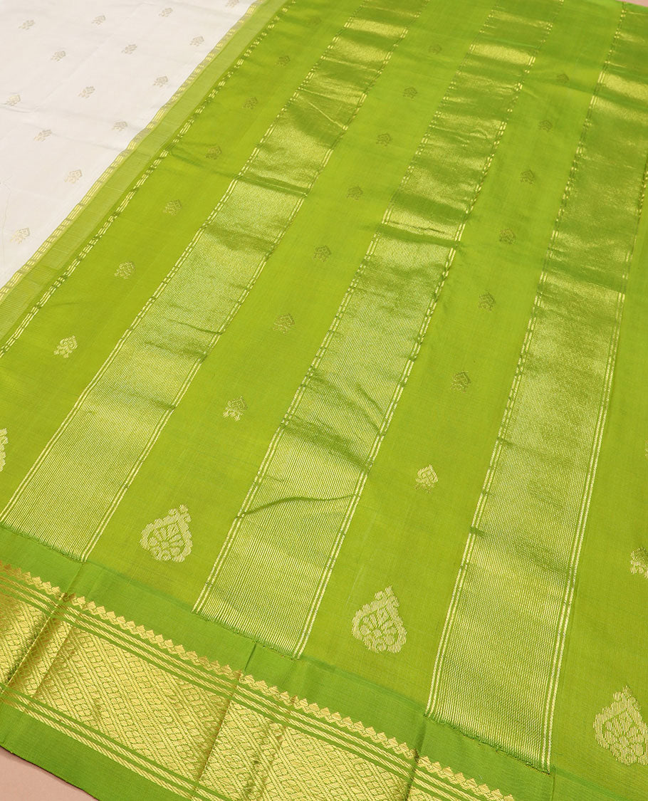 Cream zari buttas Kanchipuram silk saree, contrast thazampoo rekku border of zari designs, and zari design pallu