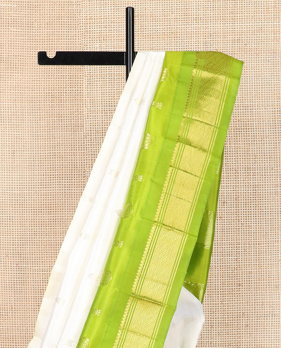 Cream zari buttas Kanchipuram silk saree, contrast thazampoo rekku border of zari designs, and zari design pallu