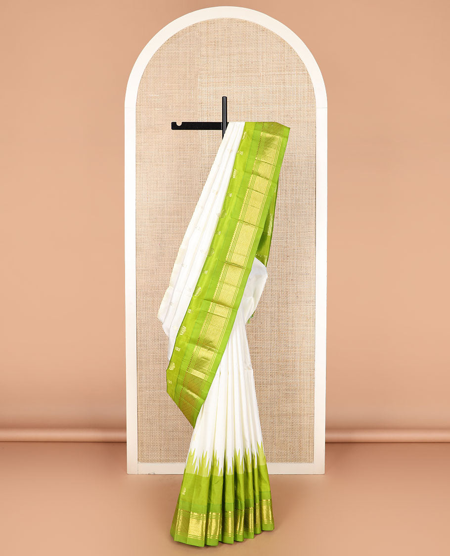 Cream zari buttas Kanchipuram silk saree, contrast thazampoo rekku border of zari designs, and zari design pallu