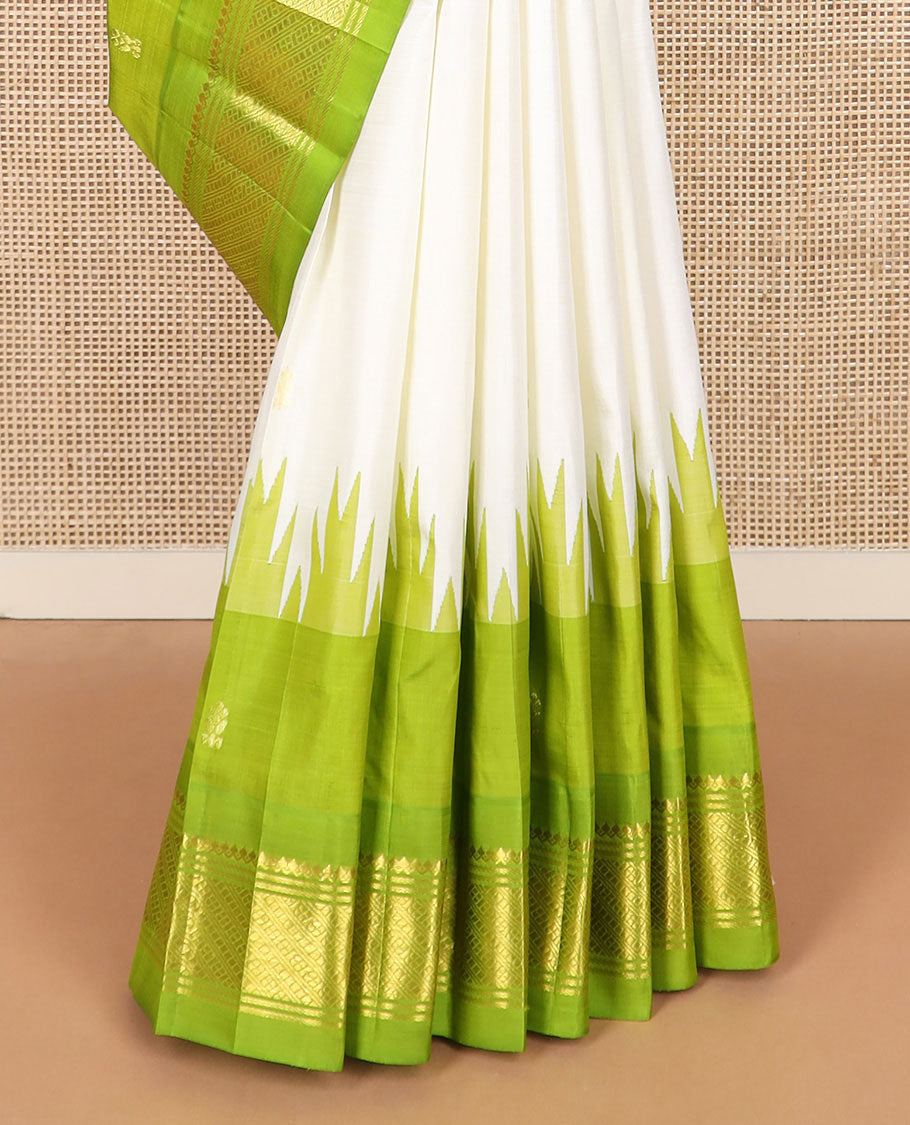 Cream zari buttas Kanchipuram silk saree, contrast thazampoo rekku border of zari designs, and zari design pallu