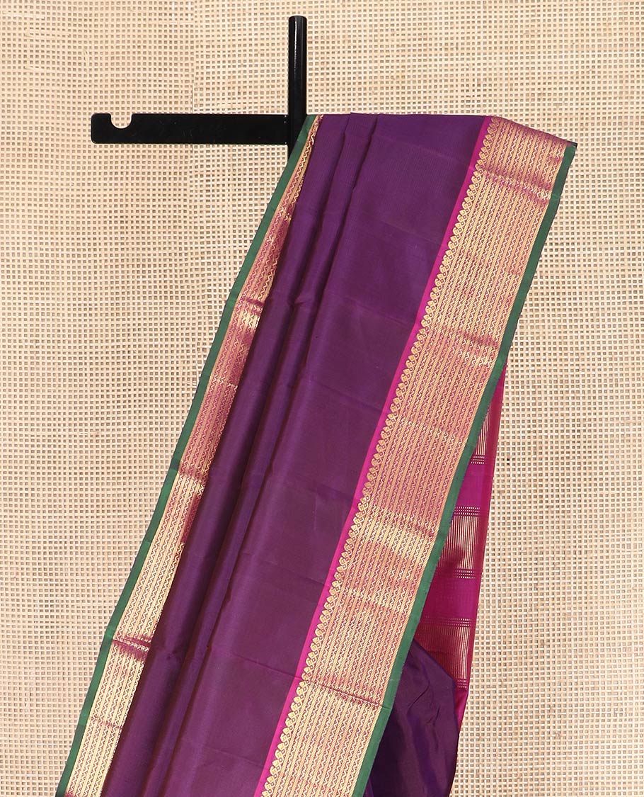 Purple Plain Kanchipuram Silk Saree, Complemented by Contrast Border Featuring Thilakam Mokku, Manga Mokku, Banaras, and Neli Designs, Pallu Adorned with Zari Designs, and Paired with a Contrast Blouse