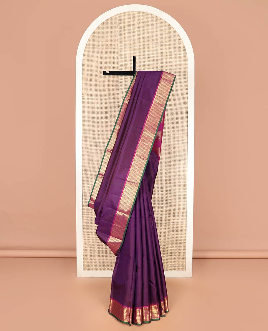 Purple Plain Kanchipuram Silk Saree, Complemented by Contrast Border Featuring Thilakam Mokku, Manga Mokku, Banaras, and Neli Designs, Pallu Adorned with Zari Designs, and Paired with a Contrast Blouse