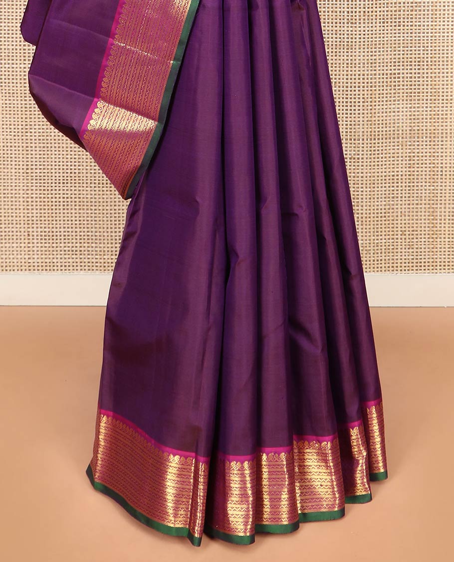 Purple Plain Kanchipuram Silk Saree, Complemented by Contrast Border Featuring Thilakam Mokku, Manga Mokku, Banaras, and Neli Designs, Pallu Adorned with Zari Designs, and Paired with a Contrast Blouse