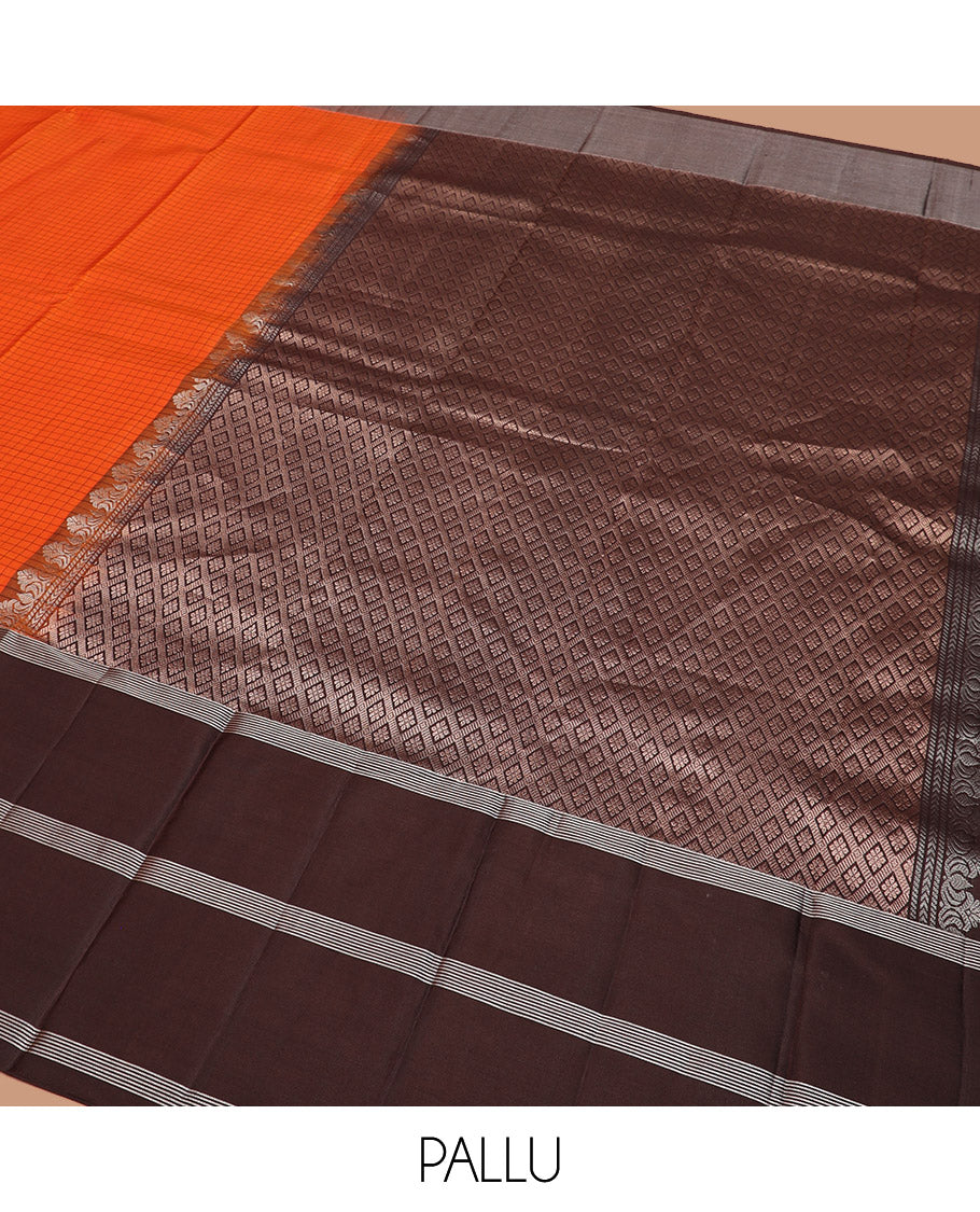Orange Kanchipuram Silk Saree Sparsely Sparkled Checks on Its Body, Complemented by a Contrast Border of Iruthalai Pakshi Butta Enclosed Checks, Gleaming Pallu of Jaal Designs, and Paired with a Contrast Blouse