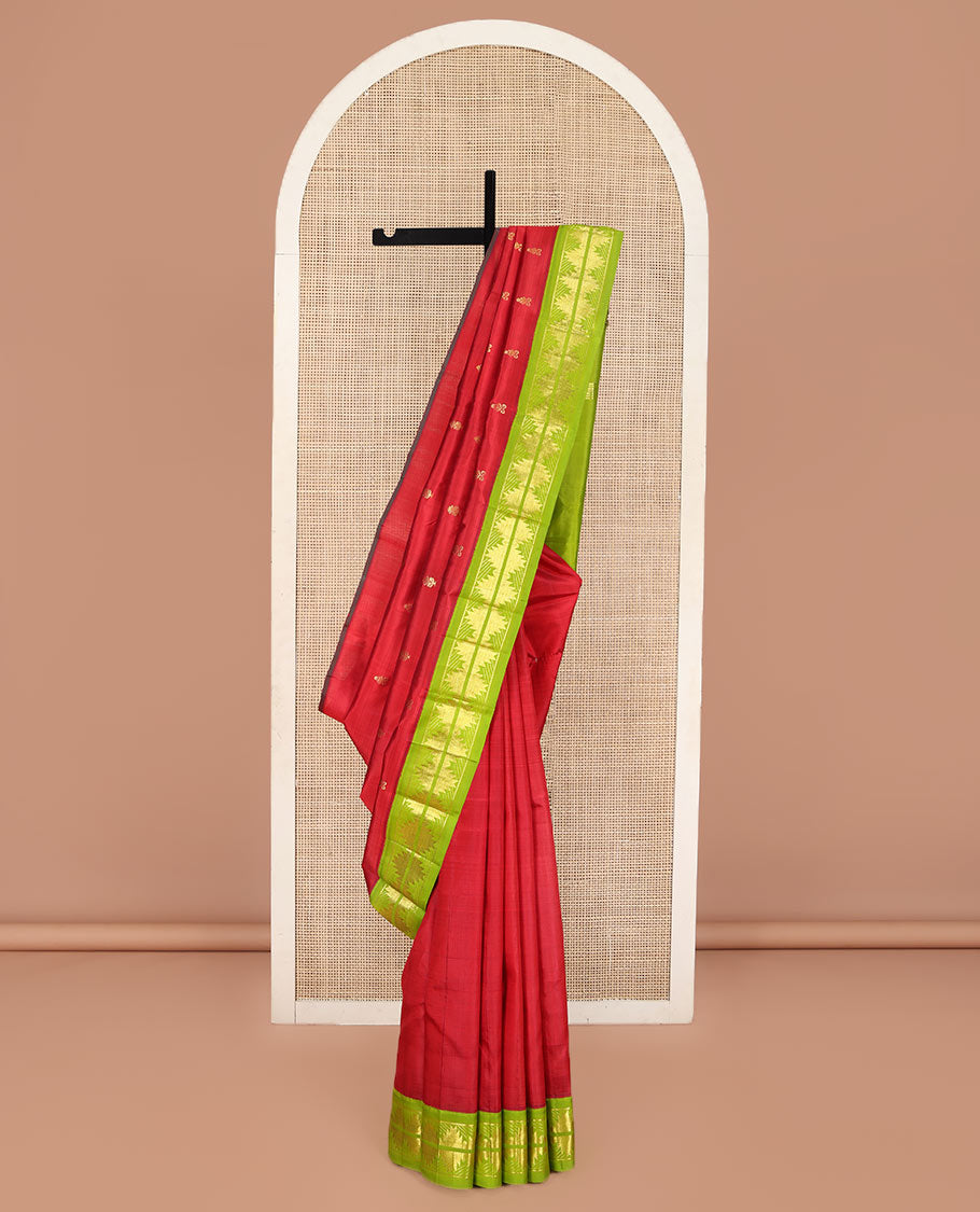 Red Kanchipuram Silk Saree, Detailed with Zari Buttas on Its Body, Complemented by a Contrast One-Sided Korvai Border of Thazampoo Rekku Designs, Pallu Depicts Zari Designs, and Comes Without a Blouse