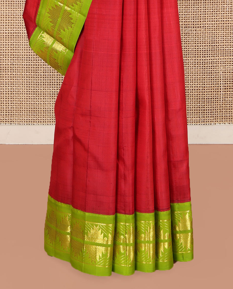 Red Kanchipuram Silk Saree, Detailed with Zari Buttas on Its Body, Complemented by a Contrast One-Sided Korvai Border of Thazampoo Rekku Designs, Pallu Depicts Zari Designs, and Comes Without a Blouse