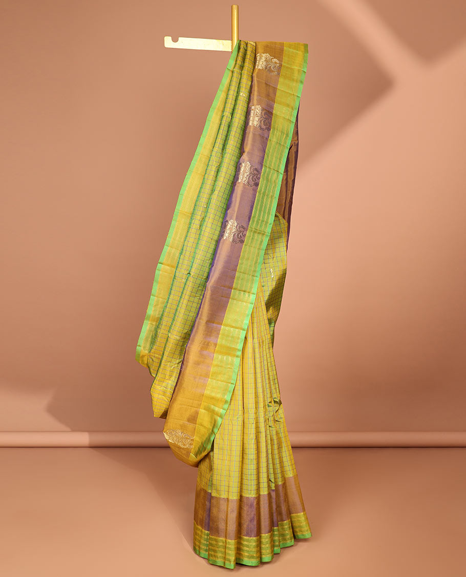 Green checked kancheepuram silk saree with contrast floral zari design & intricate zari design pallu