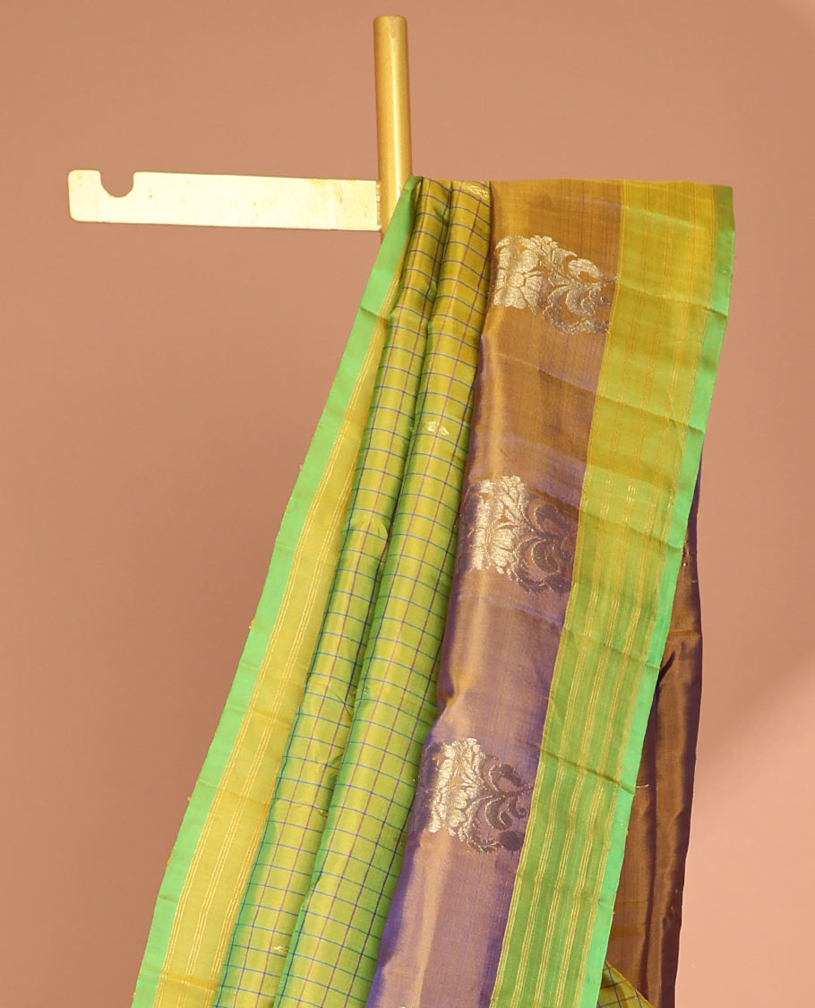 Green checked kancheepuram silk saree with contrast floral zari design & intricate zari design pallu