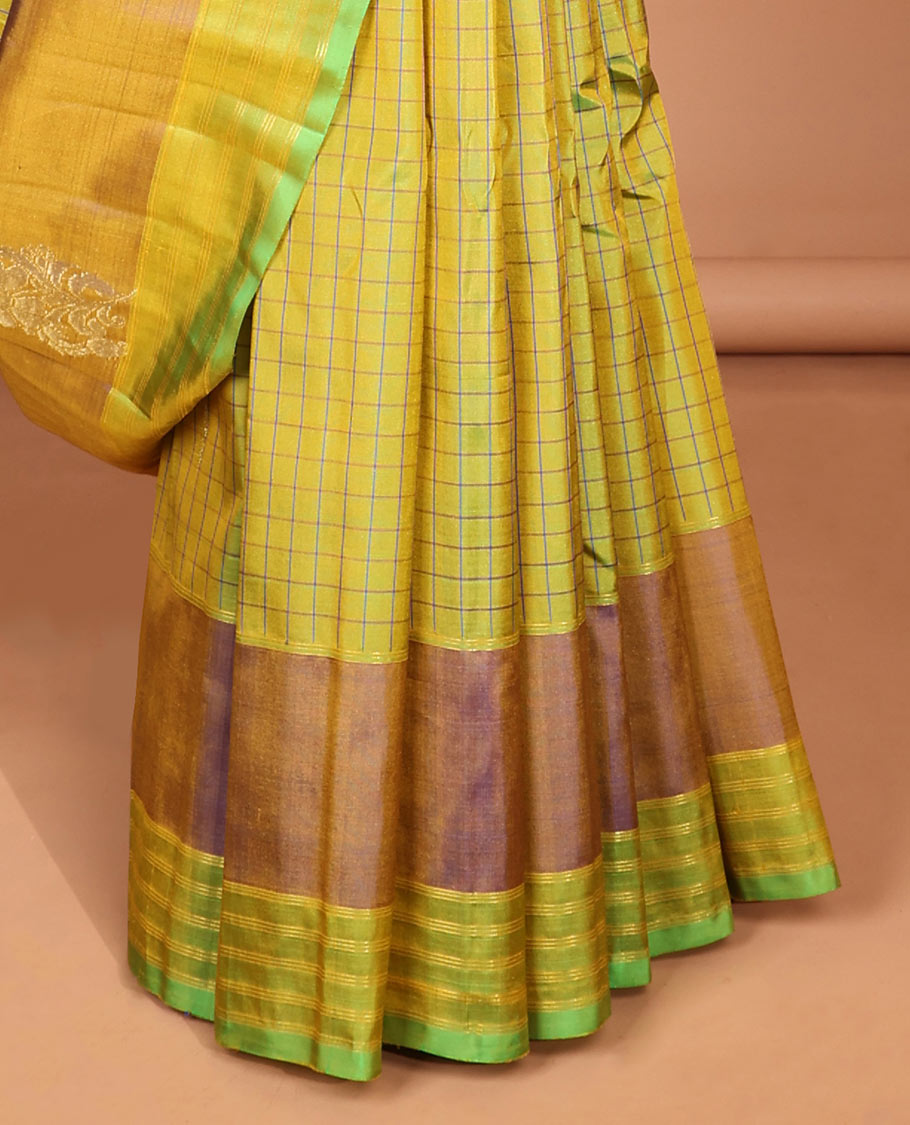 Green checked kancheepuram silk saree with contrast floral zari design & intricate zari design pallu