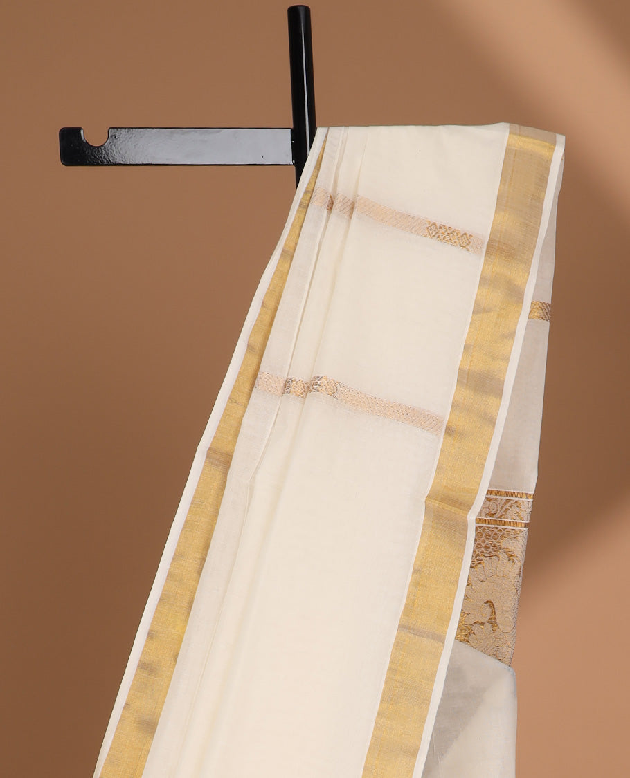 Cream kerala saree with zari designs, zari border & pallu of intricate zari designs
