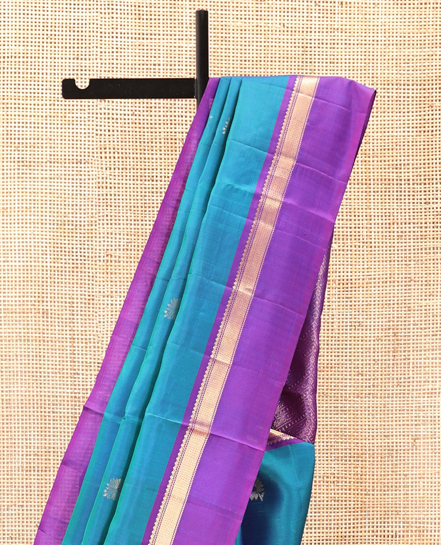 Blue Mayuri Soft Silk Saree Spotlighted with Zari Buttas All Over Its Body, Complemented by Kal Erangina Border of Vanki Designs, Diagonally Woven Pallu and Paired with a Contrast Blouse