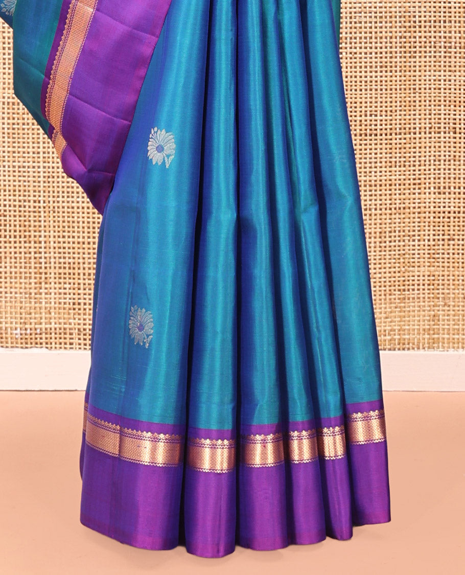 Blue Mayuri Soft Silk Saree Spotlighted with Zari Buttas All Over Its Body, Complemented by Kal Erangina Border of Vanki Designs, Diagonally Woven Pallu and Paired with a Contrast Blouse