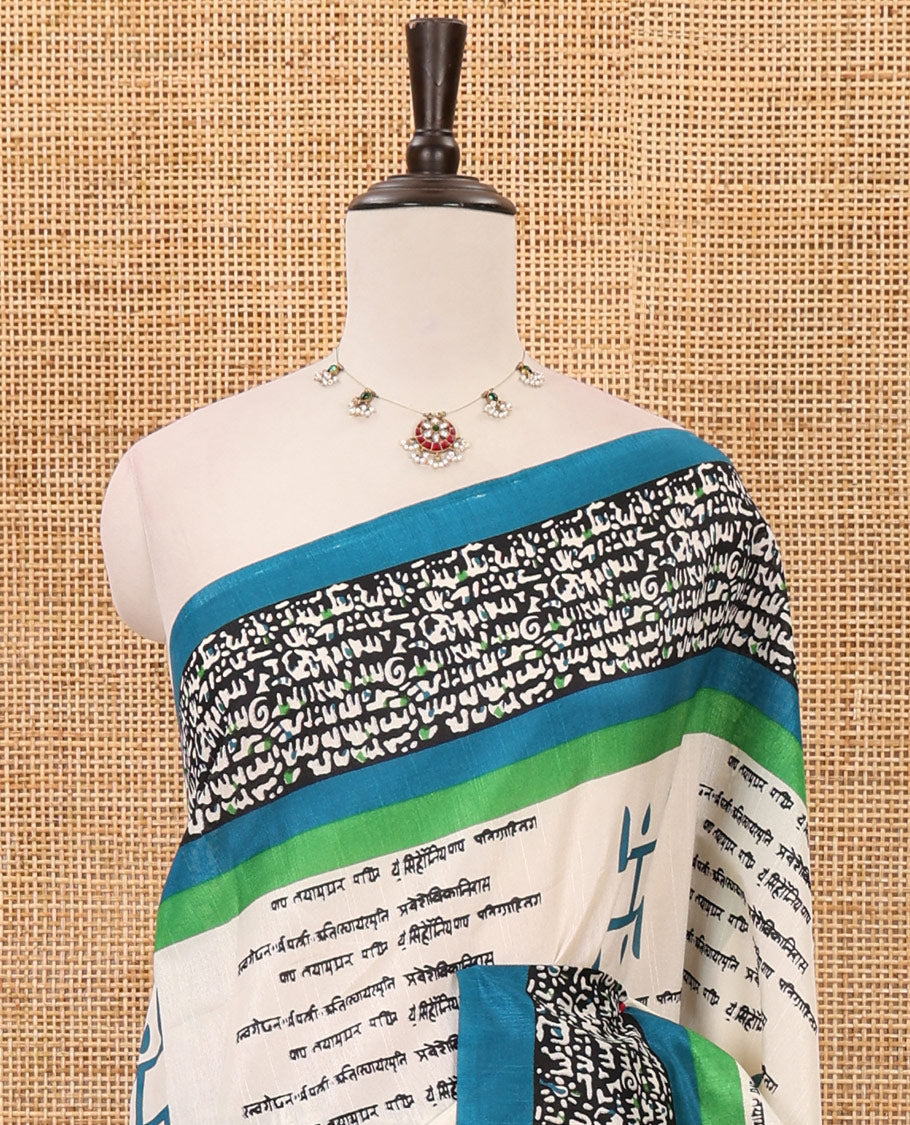 Chikku color swastika & Hindi typography printed jute cotton saree, contrast printed border, printed pallu & plain blue blouse