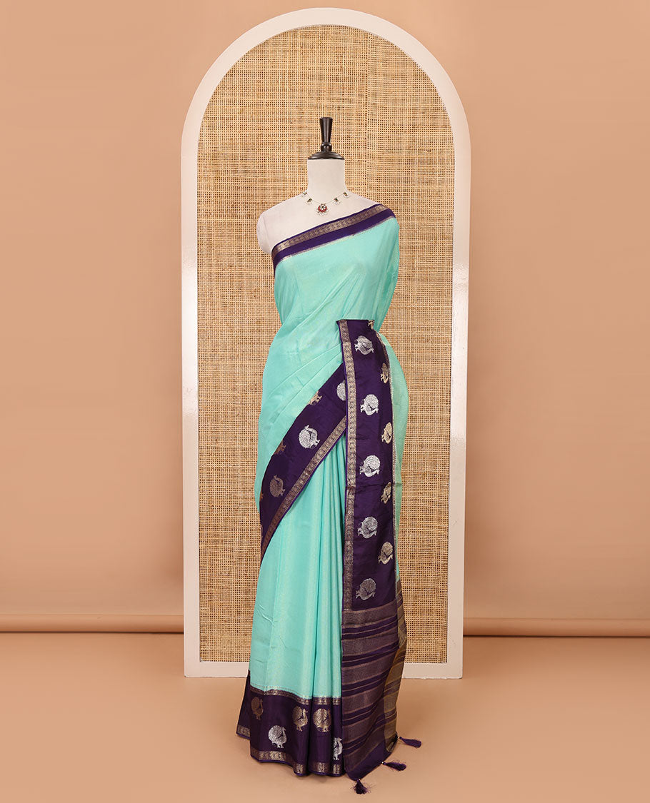 Blue plain Banarasi tissue silk saree, contrast traditional zari peacock border, zari striped pallu & floral jaal jacquard purple blouse