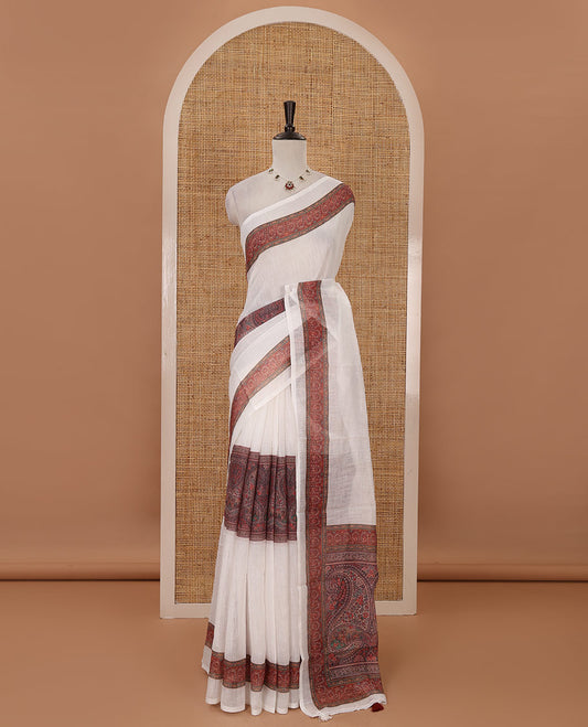 White half-plain & half-printed linen cotton saree, brown-color printed border, paisley motifs printed pallu & uniquely printed blouse