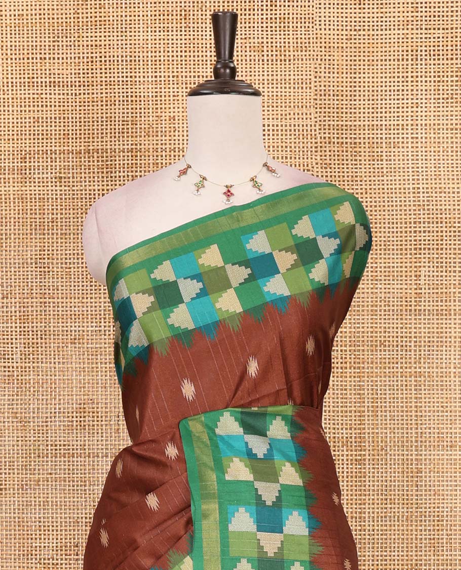 Brown striped and buttas kathan silk saree, contrast multi-color temple border, seer printed pallu, and contrast printed blouse