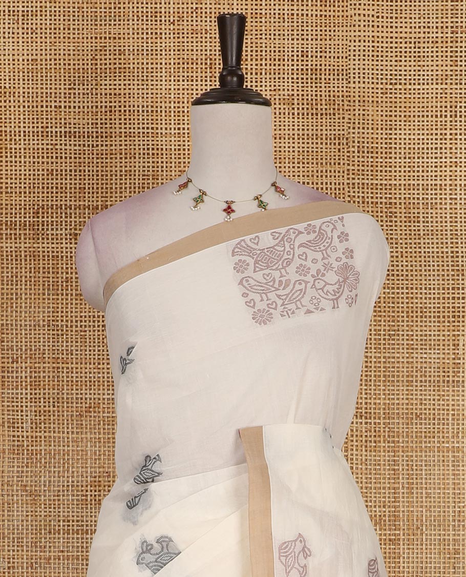 Cream bird motifs printed Handloom cotton saree, contrast piping border, pallu of bird motifs print, and a matching blouse