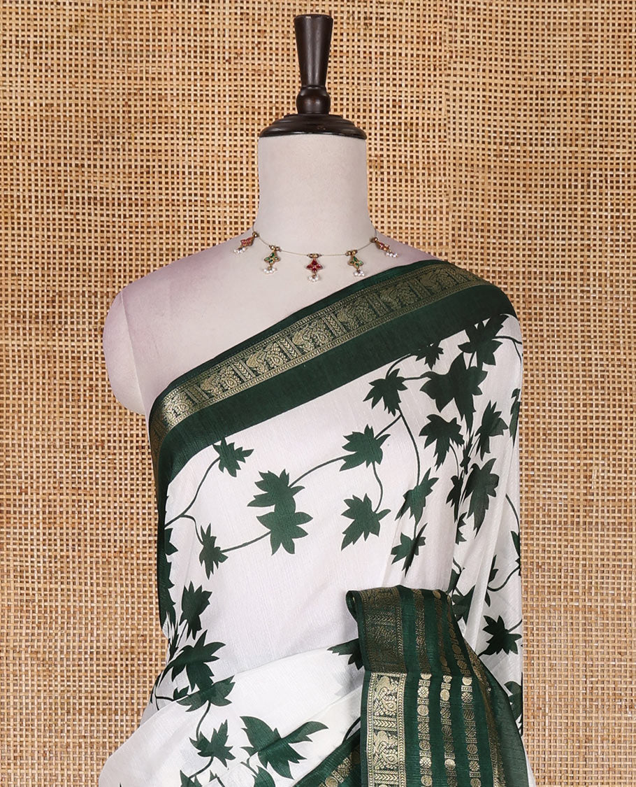 Green leaf motifs printed dola silk saree, contrast traditional zari border of Rudraksham and peacock motifs, geometric printed pallu and contrast printed blouse