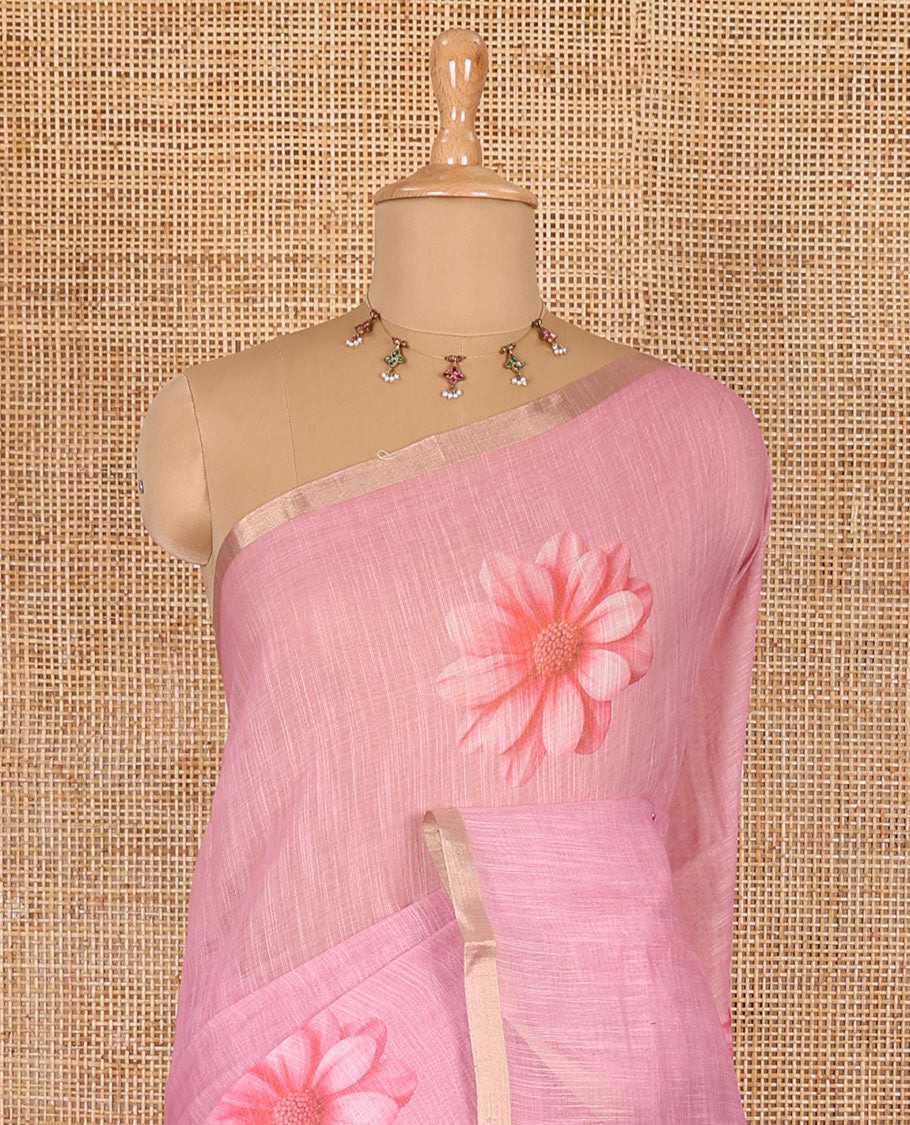 Baby pink daisy floral printed linen cotton saree, gold zari piping border, daisy floral printed pallu, and matching floral printed blouse