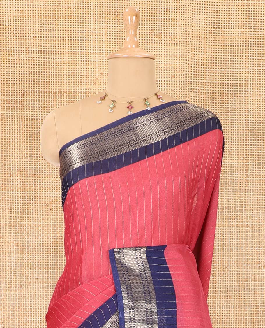 Pink vertically striped moss chiffon saree with contrast traditional zari design borders, striped pallu, and a contrast blouse