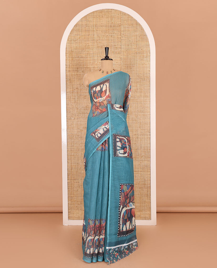 Blue plain linen cotton saree, mordern art style elephant motifs printed border, elephant printed pallu, and a leaf printed blouse