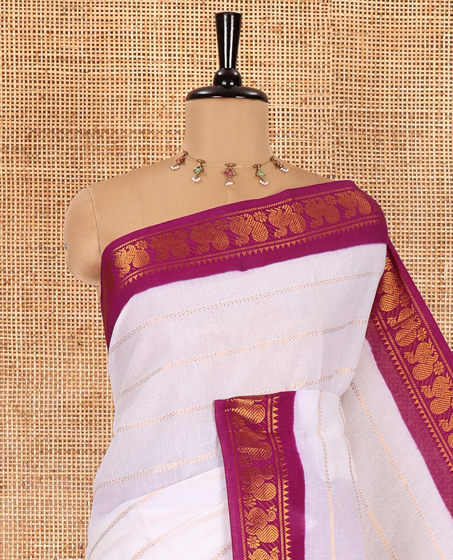 Half-white and purple Veldhari striped Sungudi cotton saree, contrast traditional border of peacock buttas, zari striped pallu, and a contrast blouse