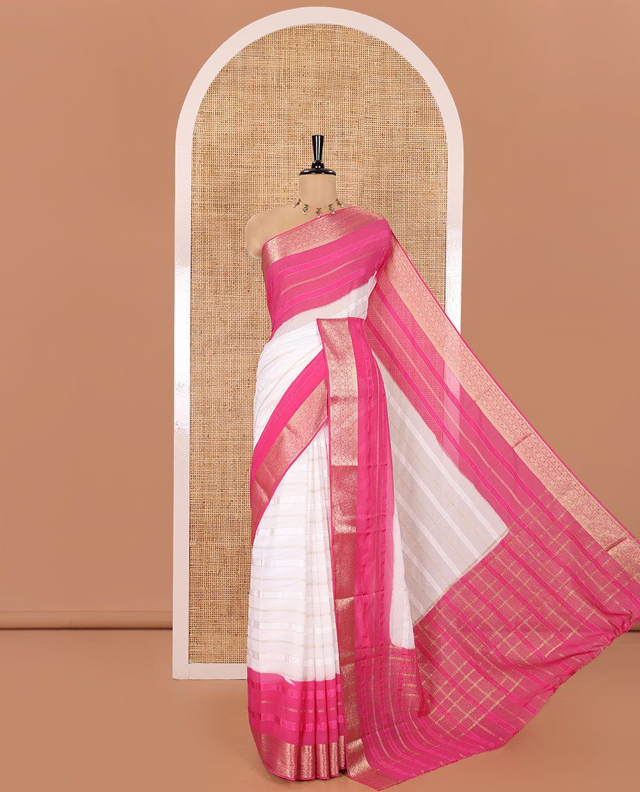 White and Rani Georgette Saree, Subtly Sparkled with Horizontal Zari Stripes All Over Its Body, Complemented by a Contrast Traditional Zari Design Border, Gleaming Zari Striped Pallu, and Paired with a Contrast Blouse