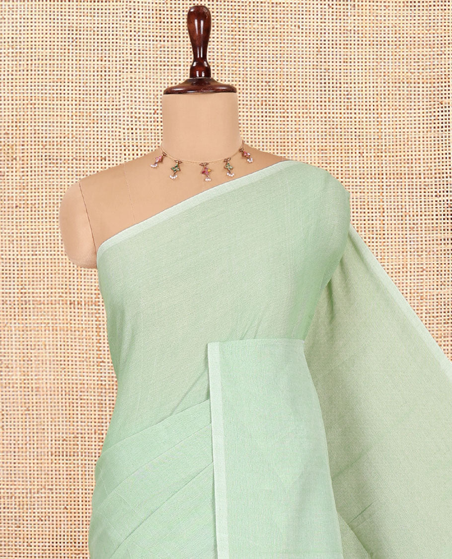 Borderless Pista Green Plain Khadi Cotton Saree, a Self-Pallu with Tassels, and a Matching Blouse