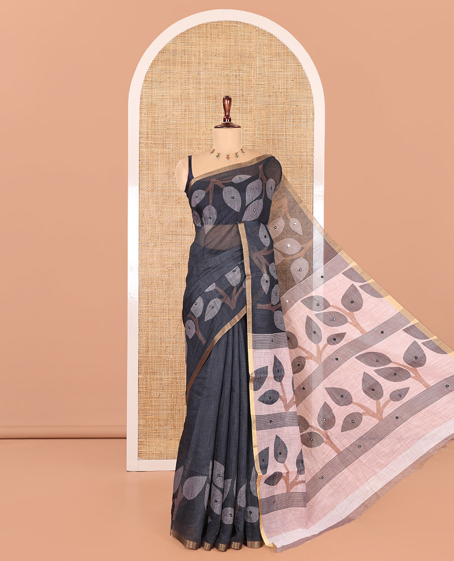 Black Linen Cotton Saree Features Leaf Print and Mirrorwork, a Piping Border, Contrast Pallu, and a Matching Blouse