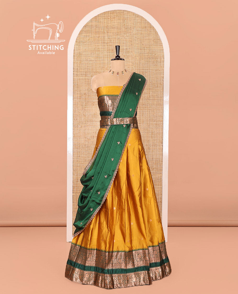 Yellow-Green Semi-Banarasi Half-Saree Subtly Sparkled with Zari Buttas on Its Skirt, Complemented by a Contrast Traditional Zari Temple Rettai Pettu Border, Paired with a Matching Blouse, and a Satin Georgette Embroidered Scallop Dhavani