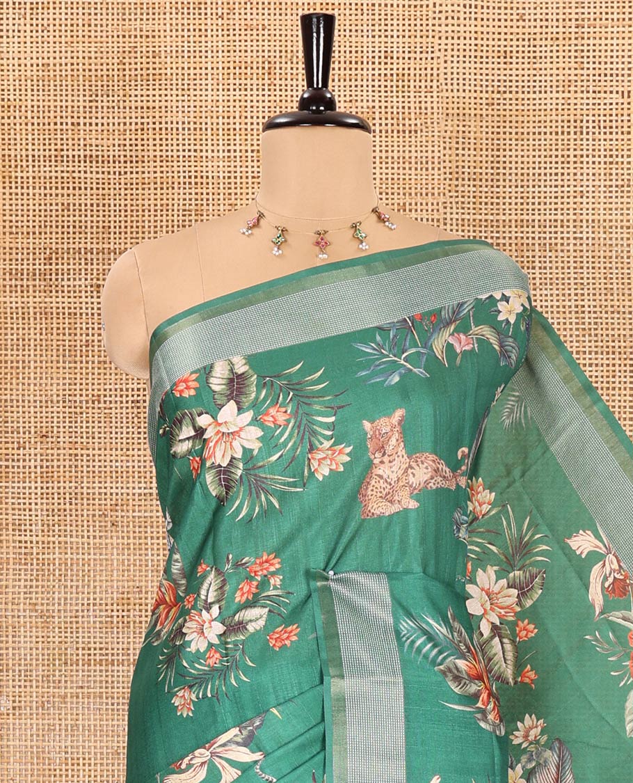 Green tropical floral and fauna motifs printed fancy tussar saree, resham border, self-pallu, and a matching blouse of print with resham thread stripes