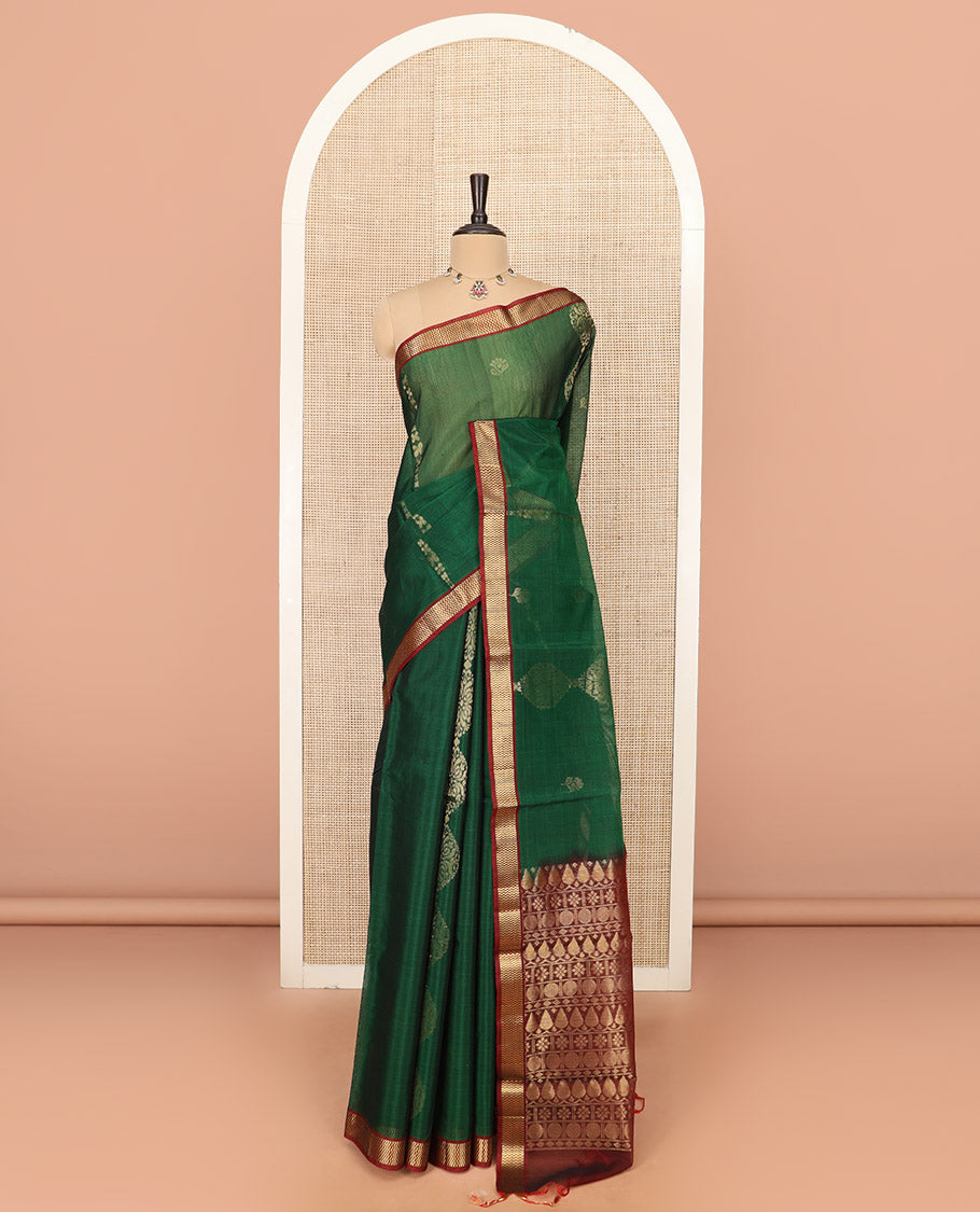 Green Silk Cotton Saree Beautified with Buttas All Over the Body, Complemented by a Contrast Chevron Striped Zari Border, Featuring a Contrast Pallu Steeped With Geometric Designs, and Paired with a Contrast Blouse